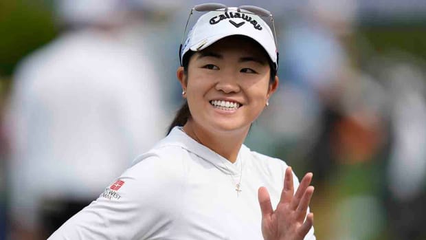 Rose Zhang waves on the driving range prior to the start of the 2023 KPMG Women's PGA Championship.